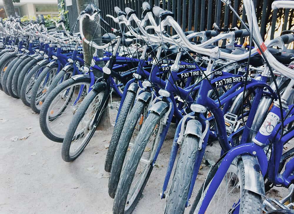 blue city bikes lined up in a row