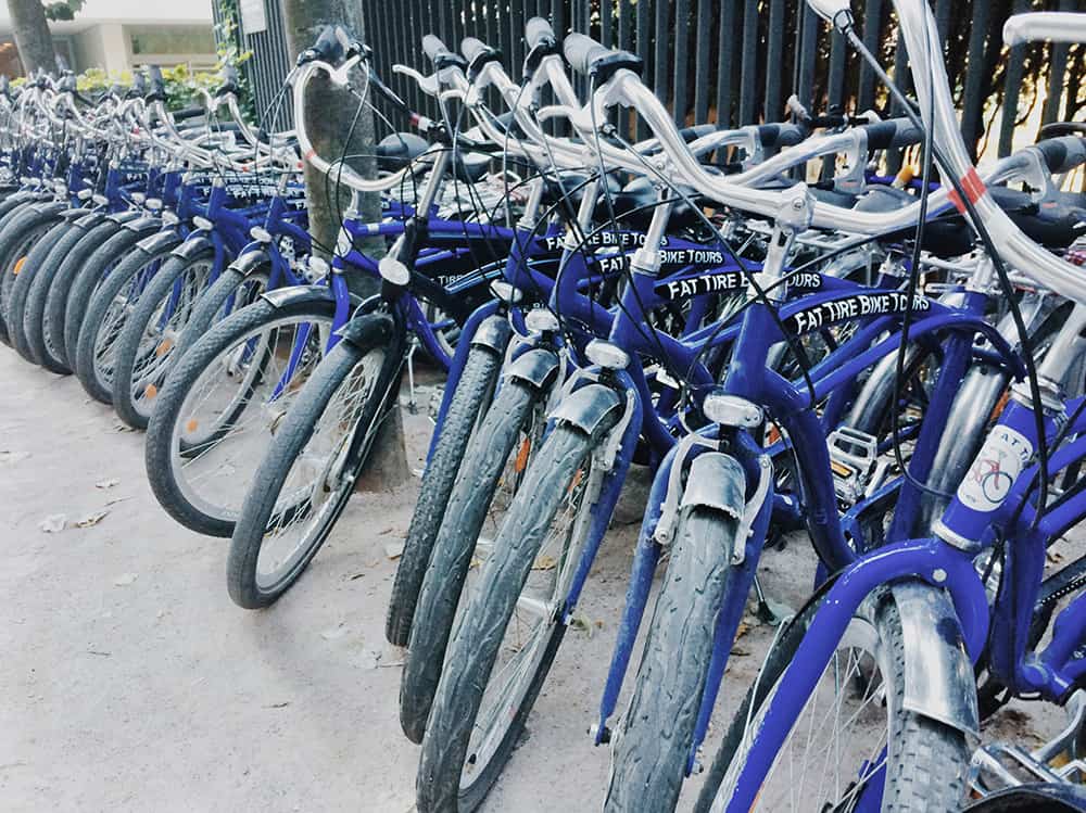 blue city bikes lined up in a row