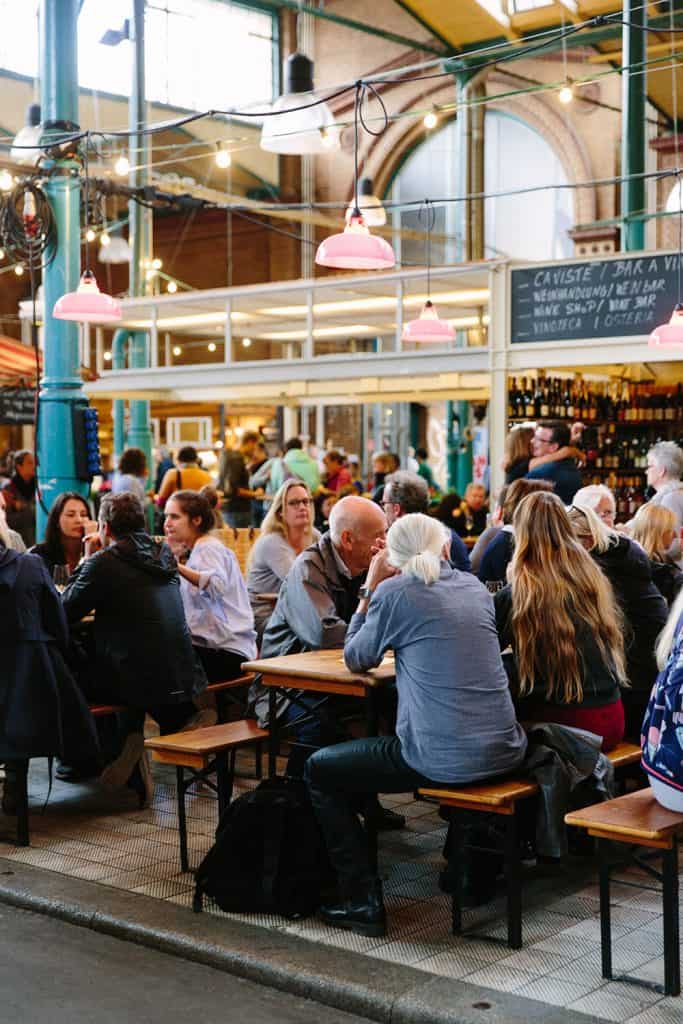 people eating at tables at Markthalle Neun