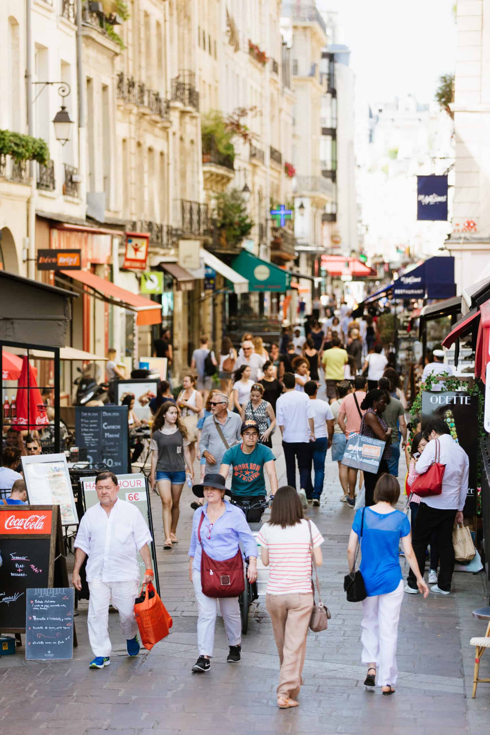 Shopping on Rue Montorgueil in Paris, France.