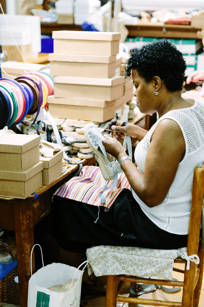 lady making espadrilles in barcelona, spain