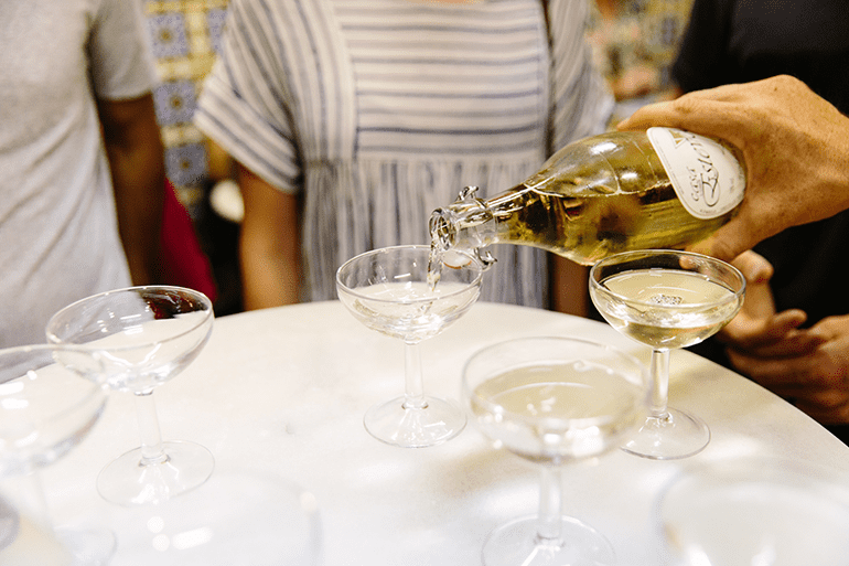 a glass of cava is poured
