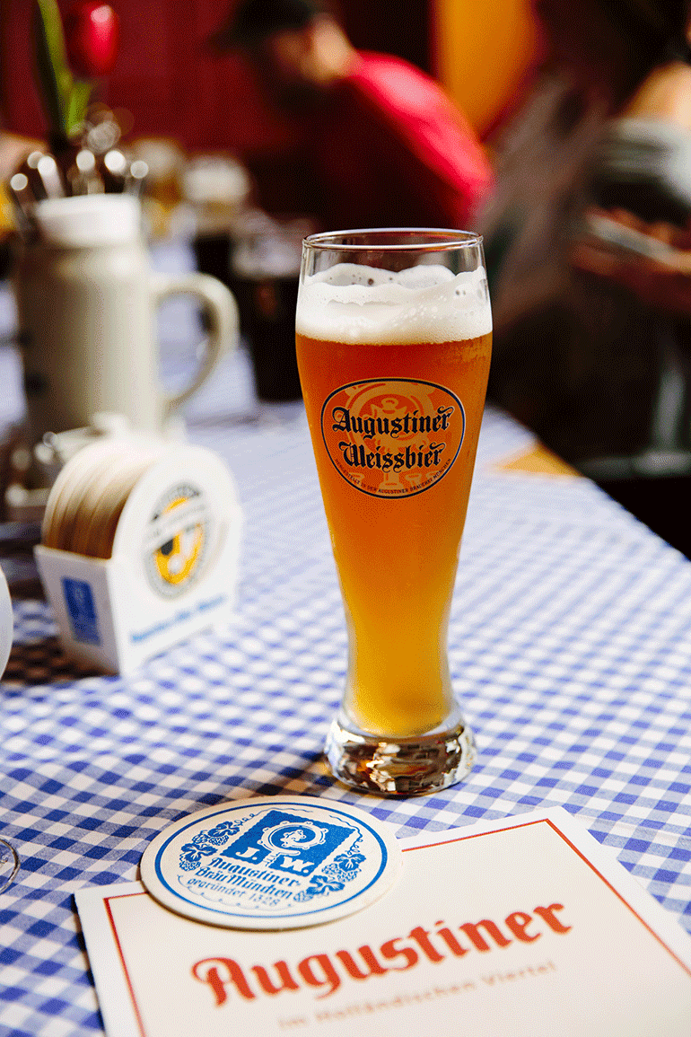Close up of an Augustiner Weissbier at a traditional German restaurant.
