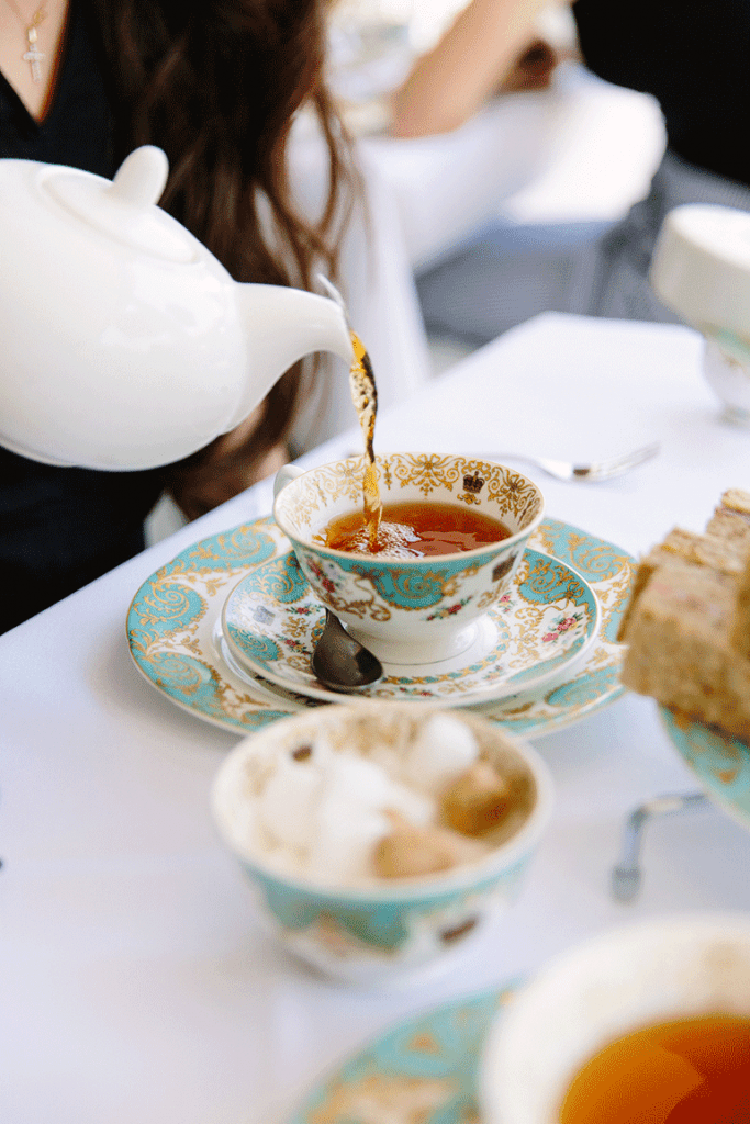 pouring tea at kensington palace