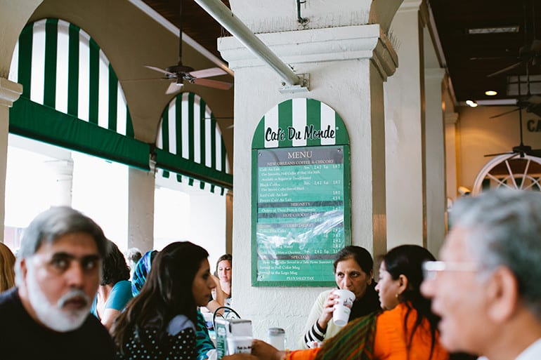 Scenes at popular beignet stop Cafe du Monde in New Orleans.