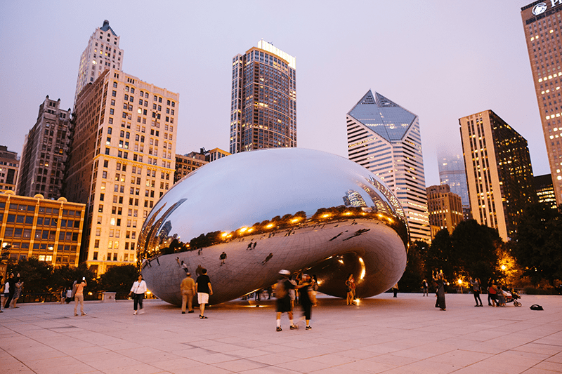 Chicago's famous Cloudgate sculpture, more commonly called "The Bean" at sunset.