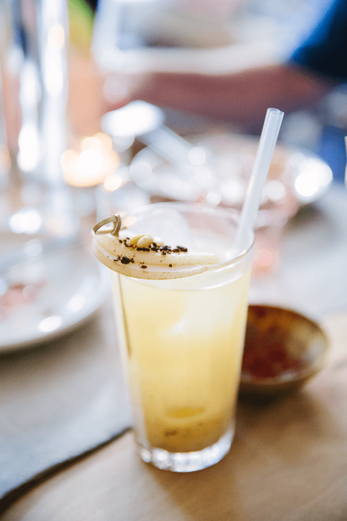 Close up of a yellow colored cocktail