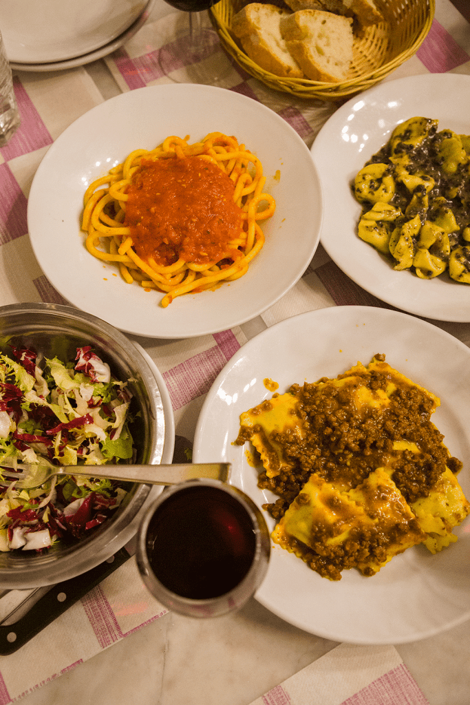 pasta dishes on a table in florence, italy