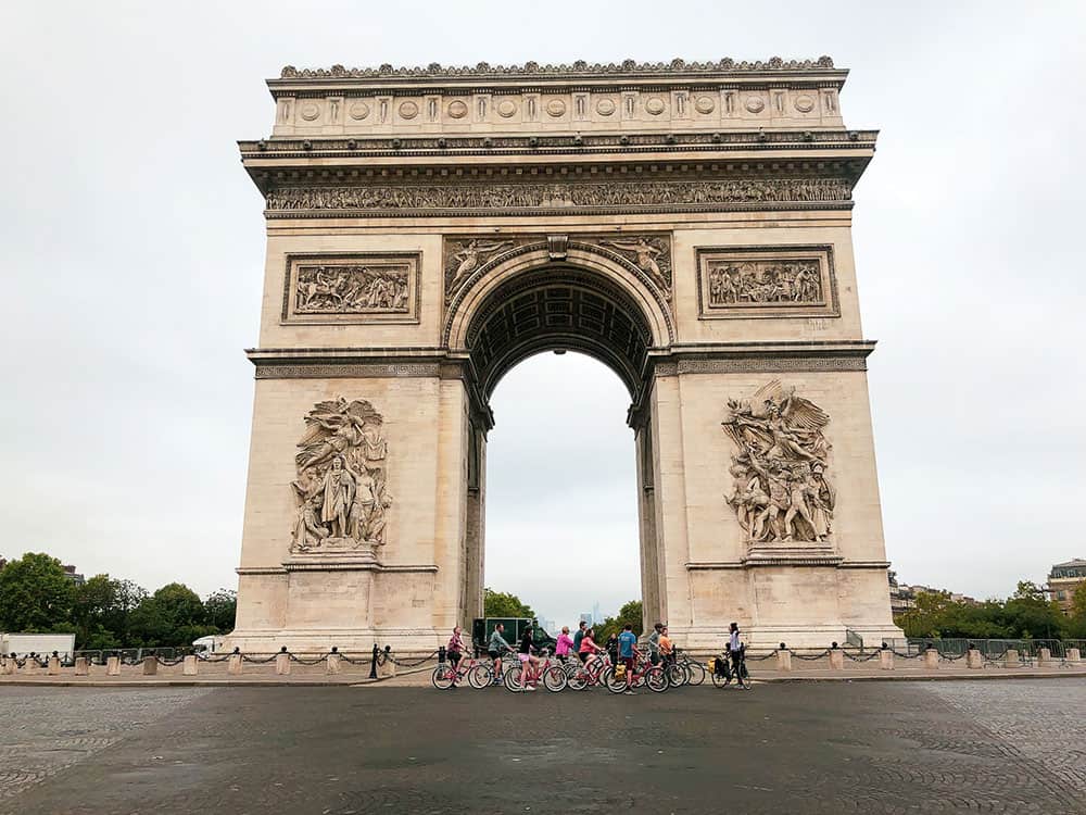 bike ride under arc de triomphe