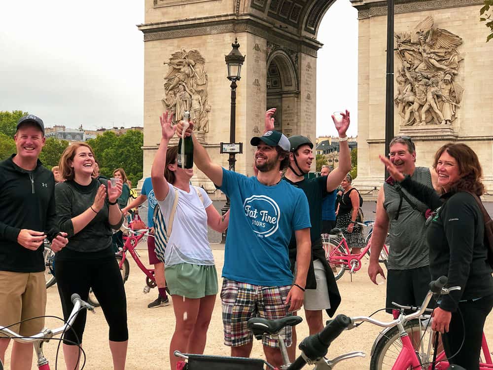 tour group celebrating with champagne