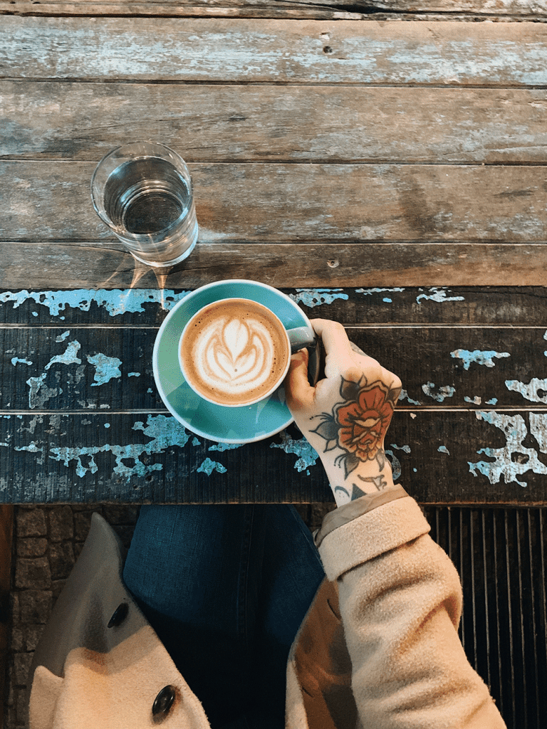 woman holding cup of coffee in berlin