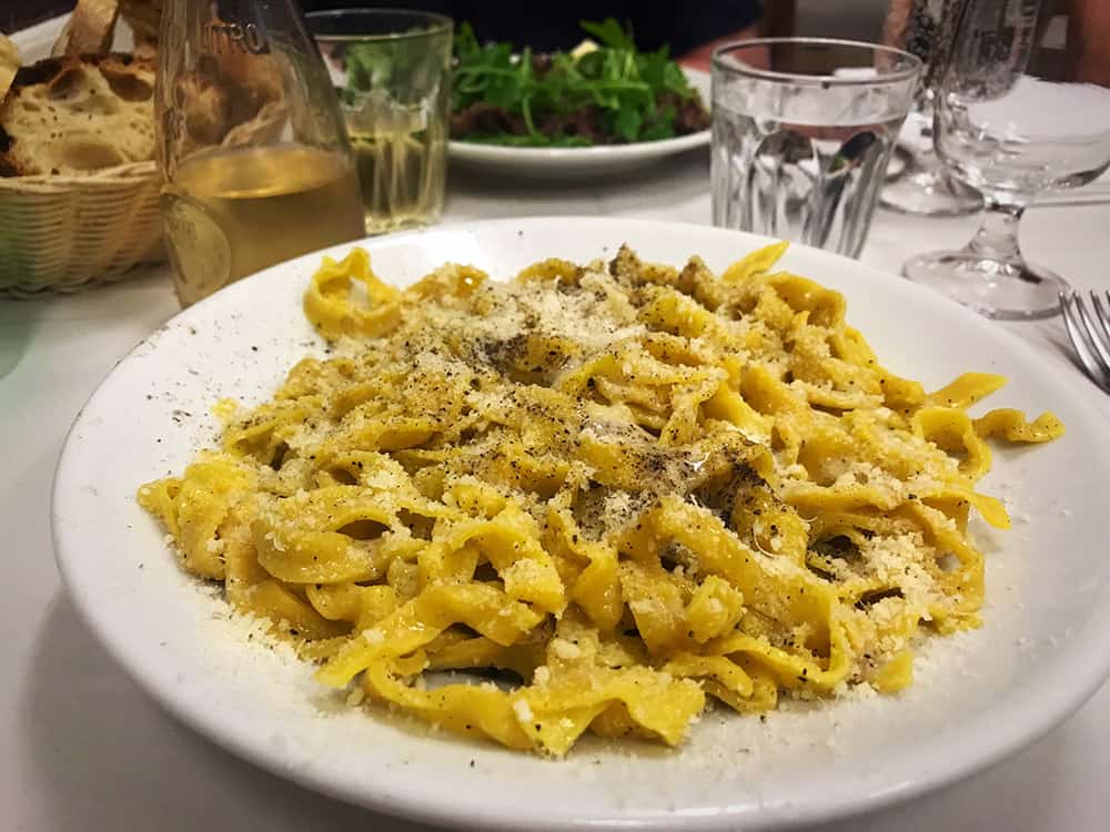 cacio pepe on a table in rome