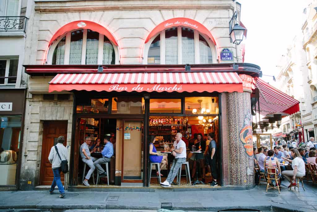 people sitting on terrace in paris.