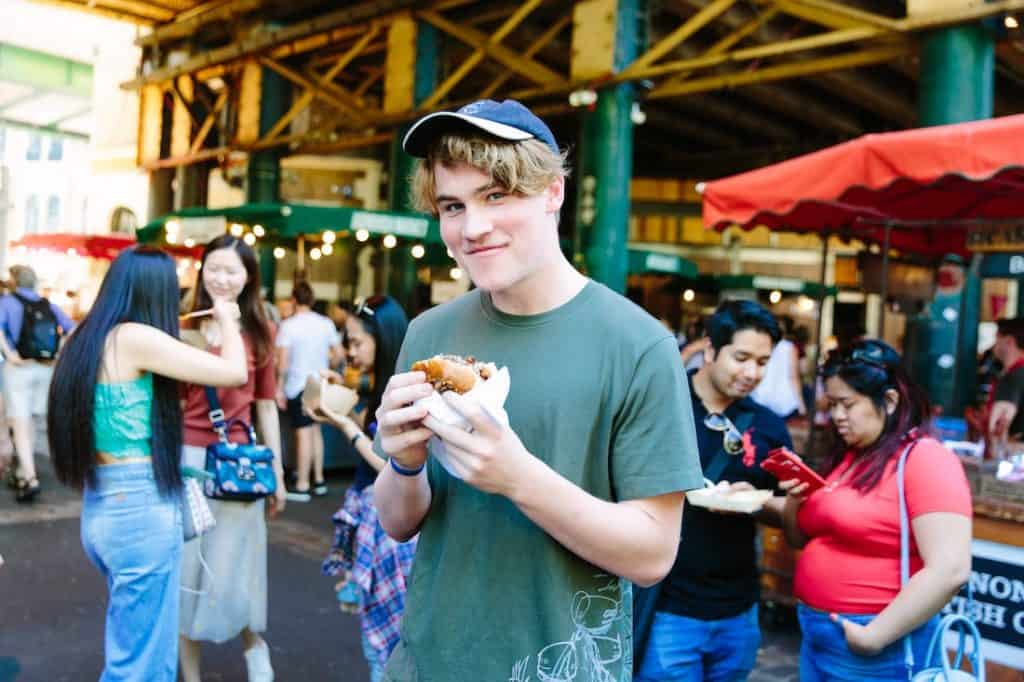 A boy enjoys a treat at Borough Market