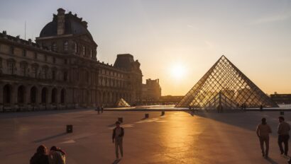 A view of the courtyard of the Louvre and the pyramid at sunset in Paris, France