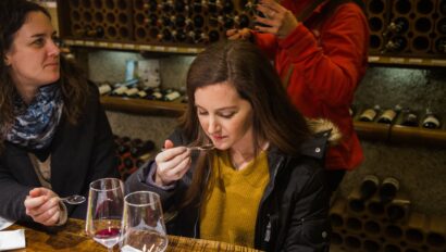 A woman smells balsamic vinegar during a tasting on the Florence Food Tour in Italy