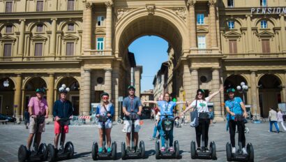A group poses on Segways in the Piazza della Repubblica in Florence, Italy