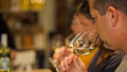 A man smells the wine in his glass during the Florence Wine Tasting in Italy