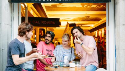 A group enjoys tapas at a bar in Barcelona, Spain