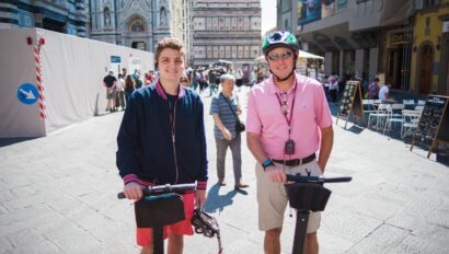 Two men riding Segways near the Duomo in Florence, Italy
