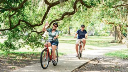 A couple rides under the Oak trees in New Orleans, Louisiana