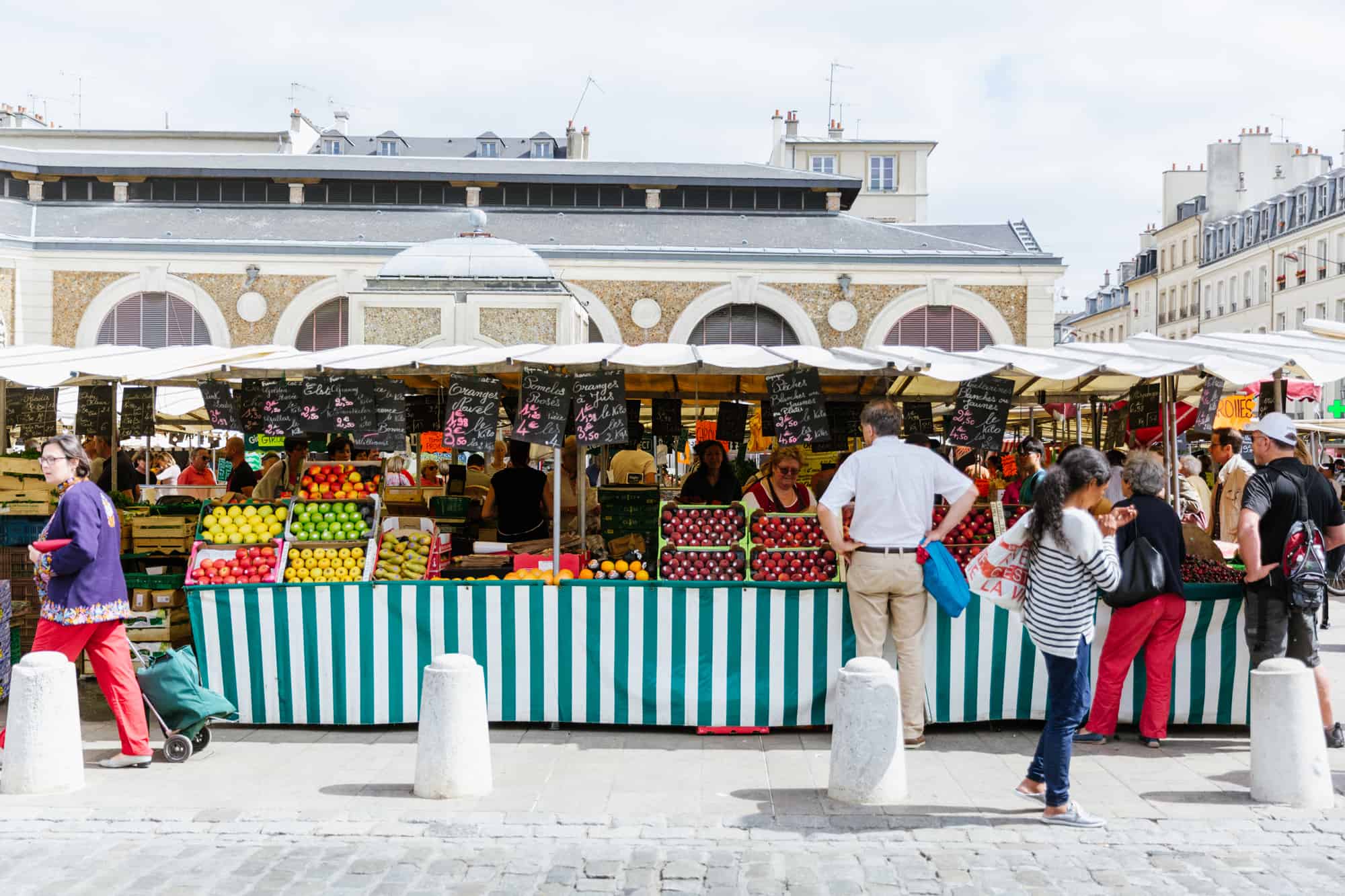 A fruit & vegetable stand at the open-air market in Versailles, France.
