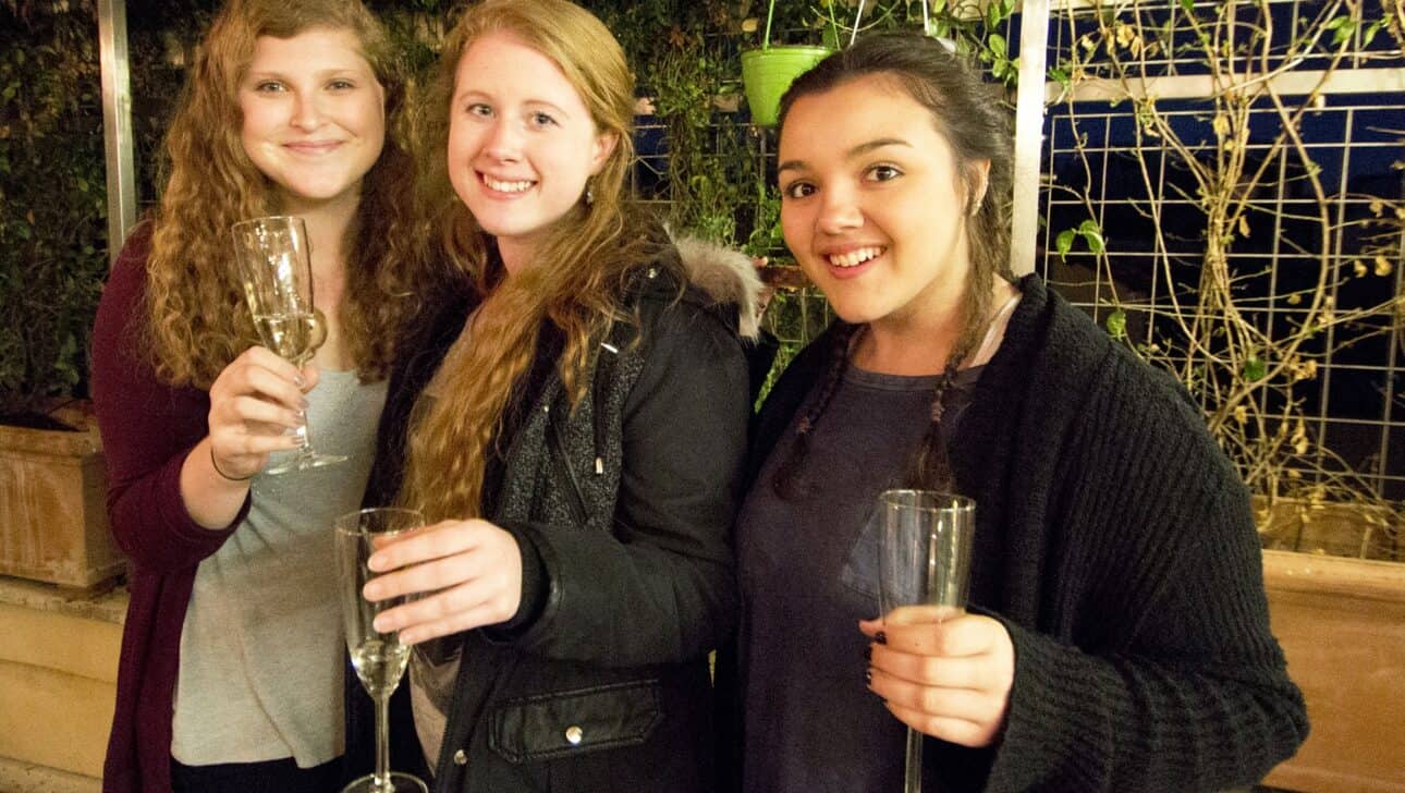 Three women enjoy Prosecco in Rome, Italy