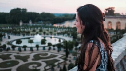 A woman overlooks the Versailles Gardens