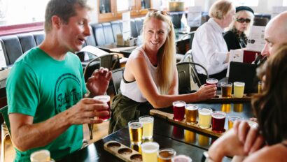 The guide explains the various beers at a pub in London, England