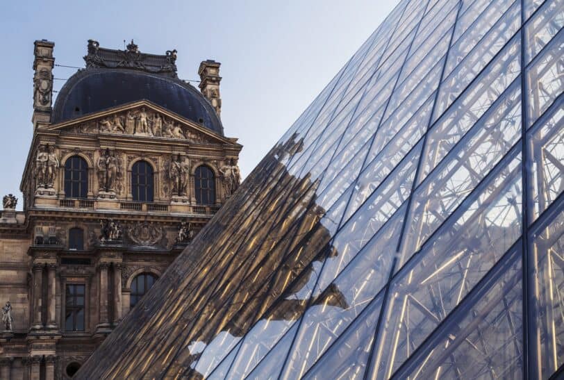 A view of the Louvre museum with the Pyramid in Paris, France