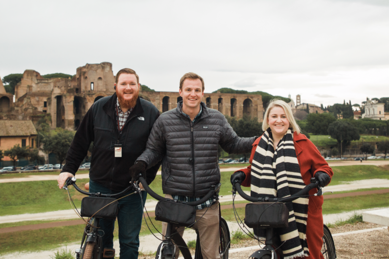 Three people on bikes in Rome