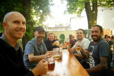 A group of guys enjoy a pint in a local Berlin beer garden