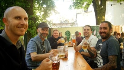A group of guys enjoy a pint in a local Berlin beer garden