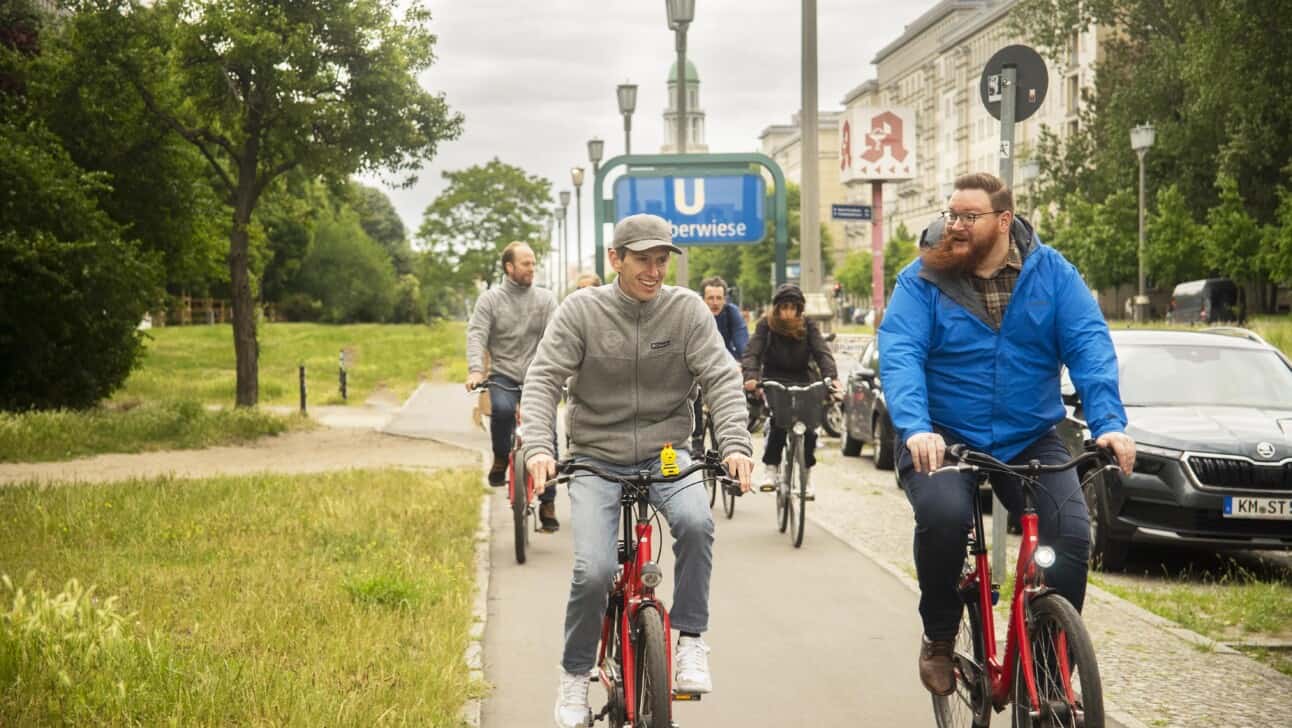 A group of bikers ride along Karl Marx Allee in Berlin, Germany