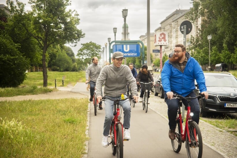 A group of bikers ride along Karl Marx Allee in Berlin, Germany