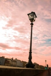 A pink sky above a lamppost in Florence, Italy
