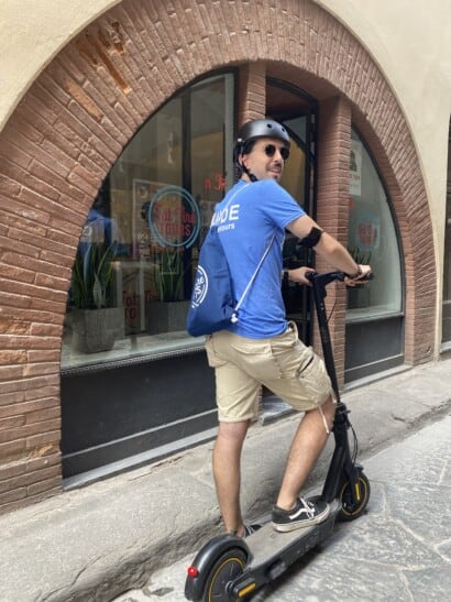 A man rides an e-scooter in Florence, Italy