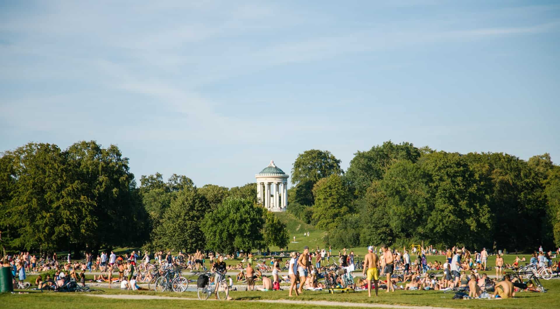 People lounging in the English Garden in Munich, Germany