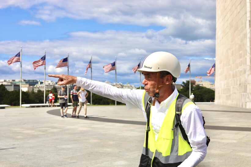 A guide in Washington, D.C. pointing out the sites