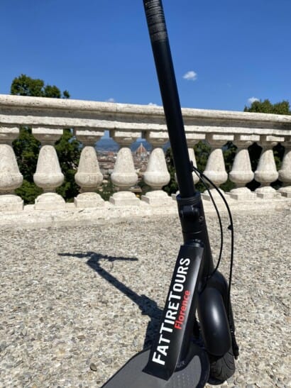 An e-scooter atop piazzale michelangelo in Florence, Italy