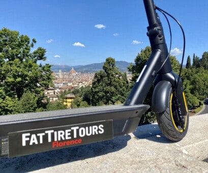 An e-scooter at a panoramic lookout over Florence