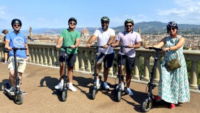 A family on e-scooters in Florence, Italy