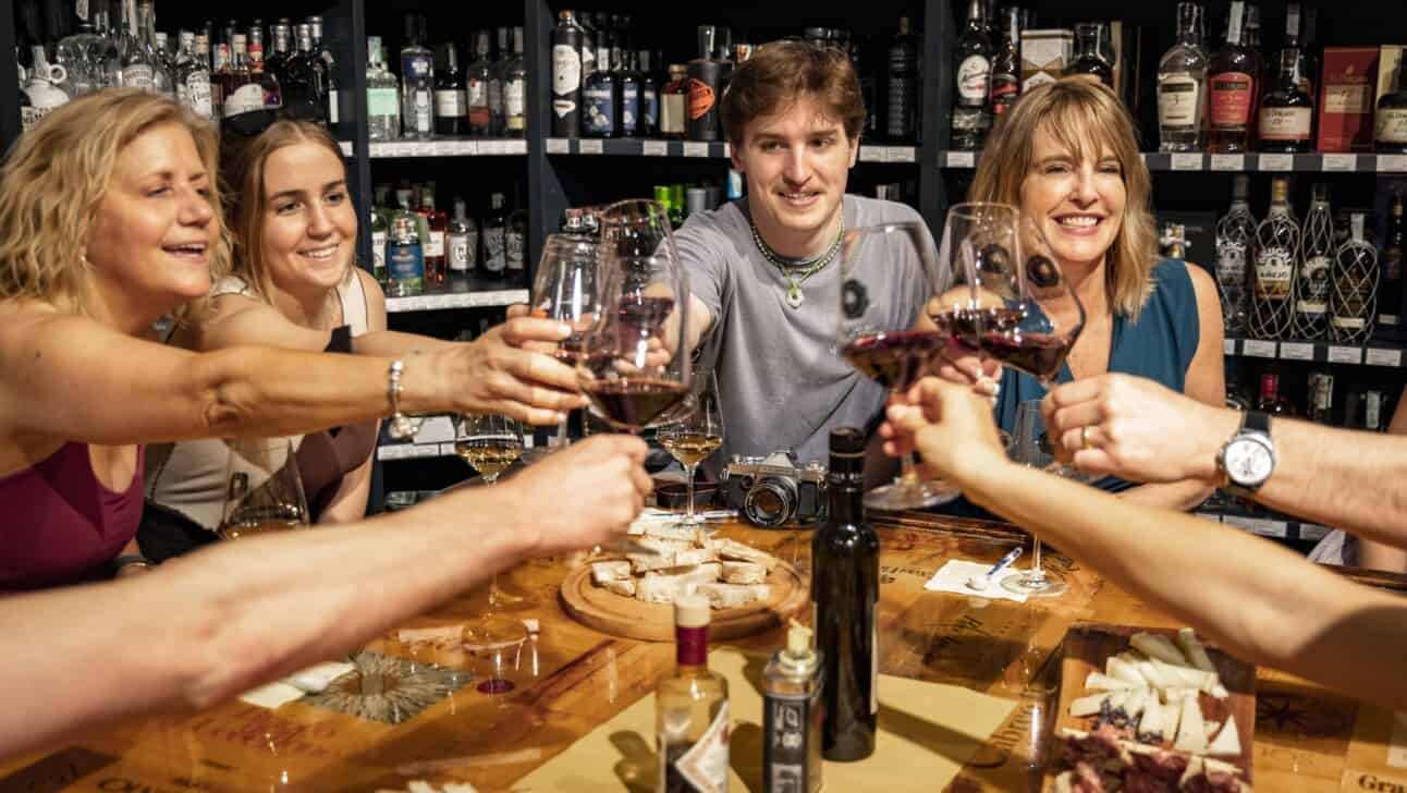 A group cheers at a wine tasting in Florence, Italy