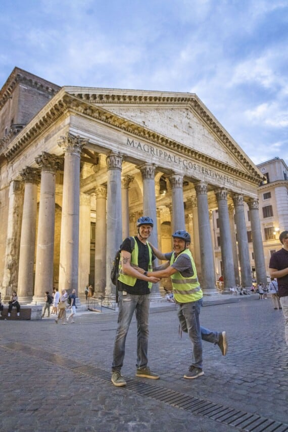 Two friends pose for a picture in front of the Pantheon in Rome, Italy