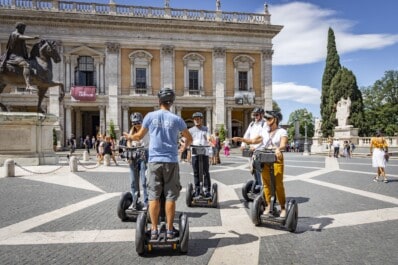A group of Segwayers listen to the guide in Rome, Italy
