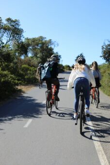 Bikers ride up an incline in San Francisco, California