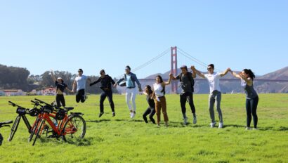 A group jumps for a photo in front of the Golden Gate Bridge in San Francisco, California