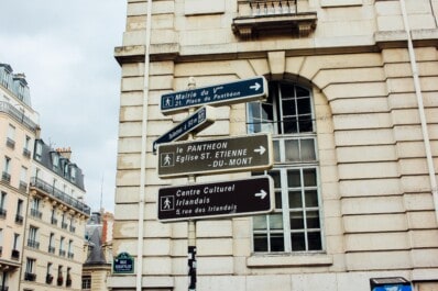 Signs pointing to various sites of interest in Paris, France