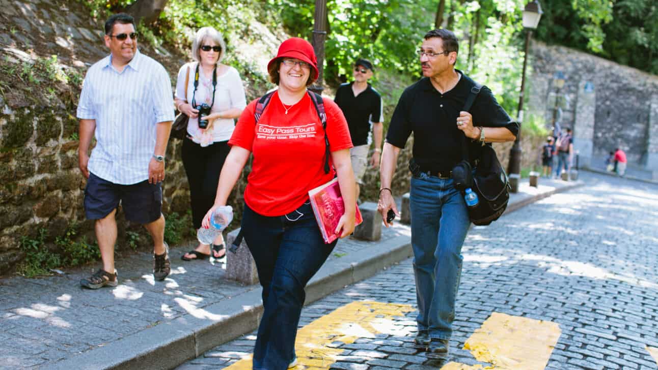 A guide walking in a city.