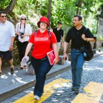 A guide walking in a city.